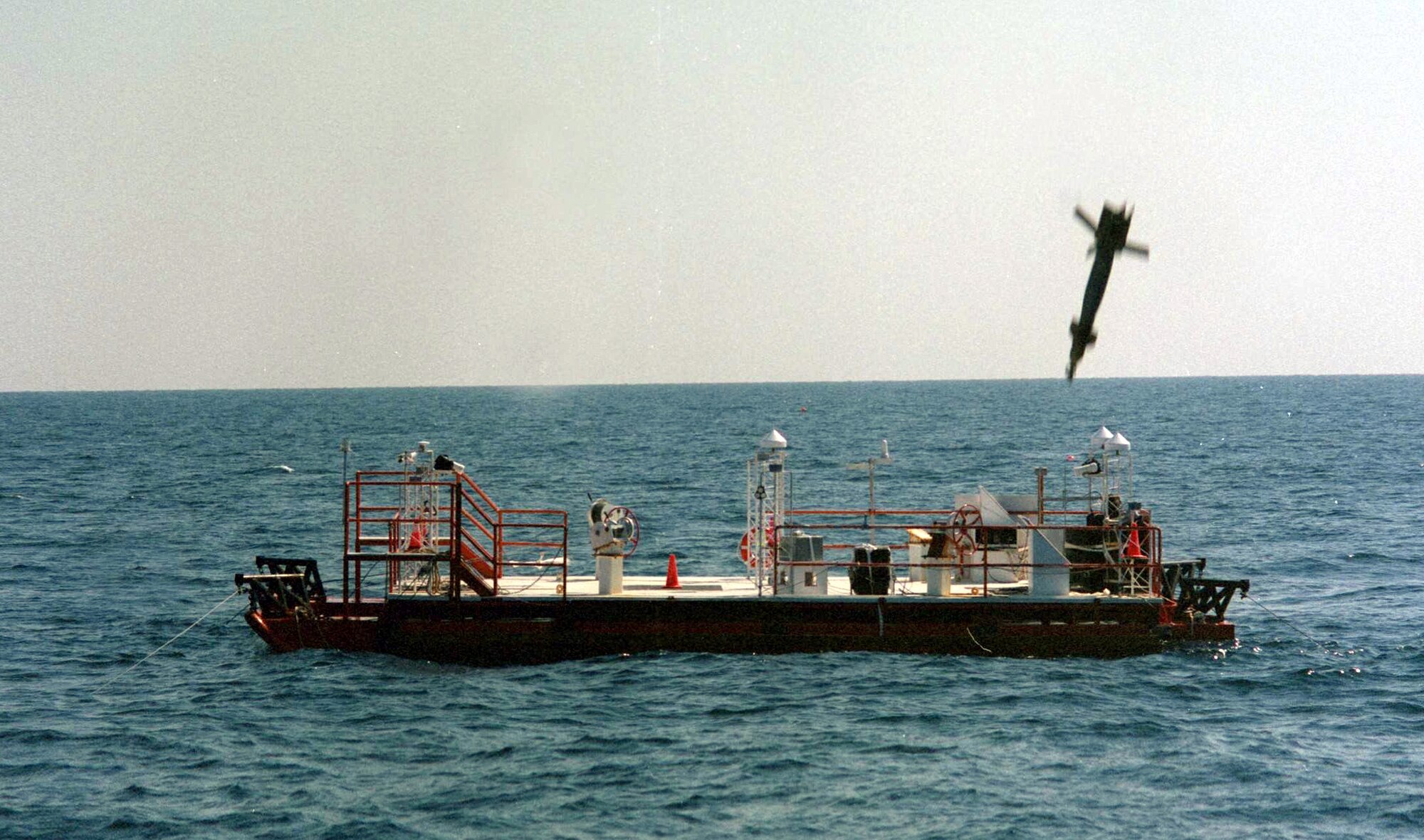 EGLIN GULF TEST RANGE, Fla. -- A GBU-12 laser-guided bomb is about to strike a barge during an offshore scoring demonstration test here.  The range is the only Department of Defense test facility capable of testing weapons like this.  (Courtesy photo)