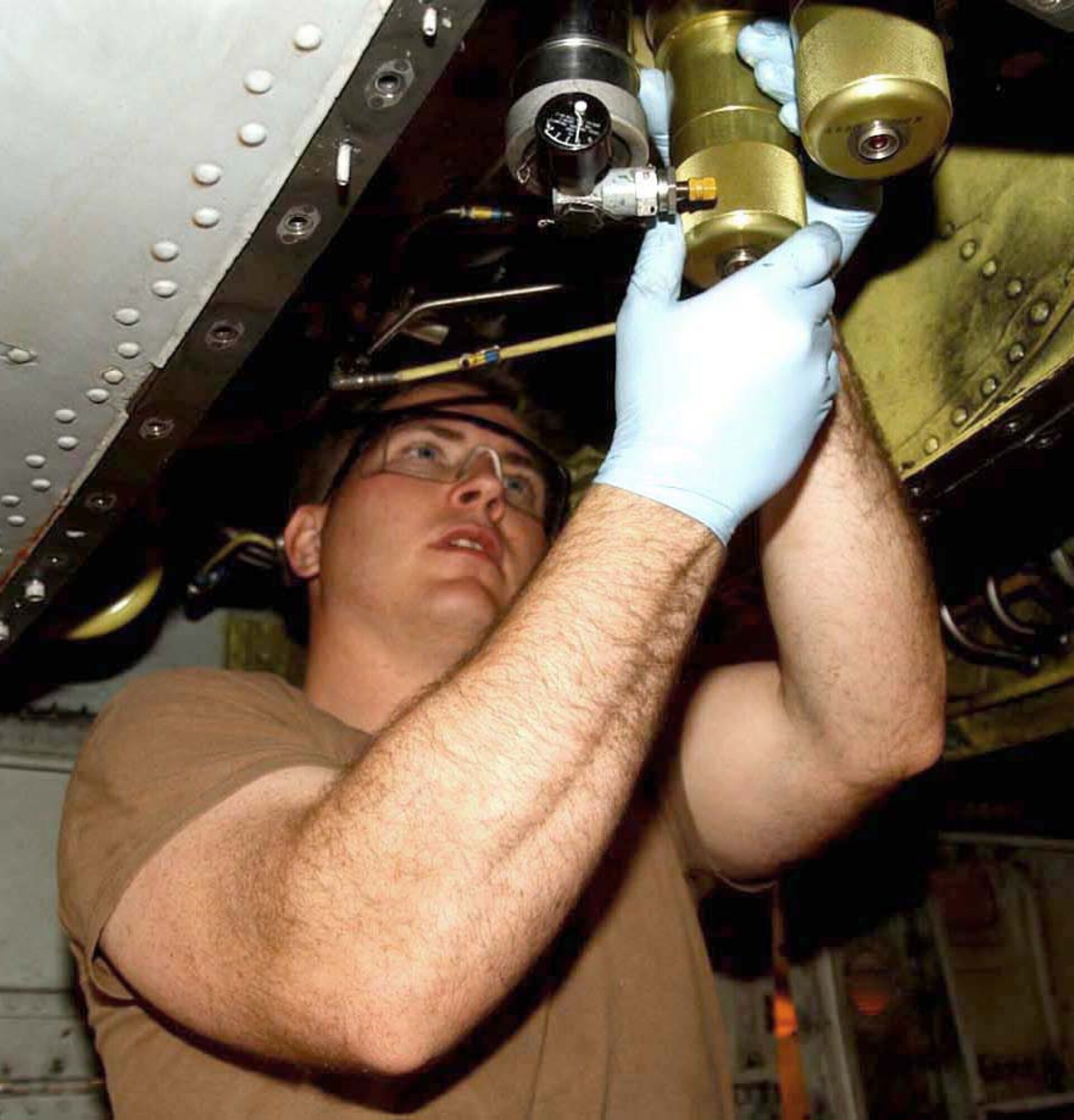 BAGRAM AIR BASE, Afghanistan -- Staff Sgt. Daniel May installs a hydraulic filter bowl to an A-10 Thunderbolt II.  He is a phase inspection craftsman with the 455th Expeditionary Aircraft Maintenance Squadron.  (U.S. Air Force photo by Master Sgt. Jeff Szczechowski)