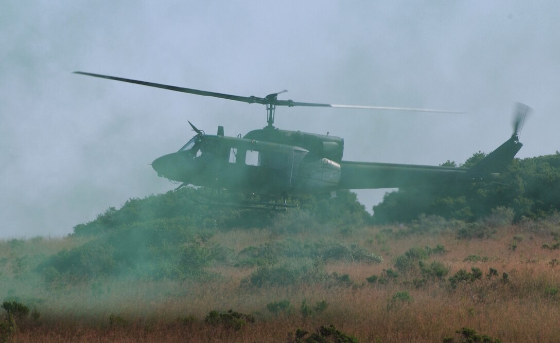 VANDENBERG AIR FORCE BASE, Calif.  -- A UH-1N helicopter lands to recover a payload of 21st Space Wing Security Forces team members during the security forces tactics competition for Guardian Challenge here May 4.  Guardian Challenge, the world's premier space and missile competition, is a four-day event held annually.  It tests the wartime readiness of Air Force Space Command's Airmen in spacelift, ICBM operations, communications, maintenance, helicopter operations, security forces and chef food preparation.  (U.S. Air Force photo by Airman 1st Class Edmund Gibbons III) 
