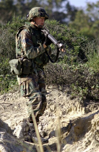 VANDENBERG AIR FORCE BASE, Calif. -- Staff Sgt Matthew Tussey aggresses opposing forces during the security forces tactics competition for Guardian Challenge here May 4.  Guardian Challenge, the world's premier space and missile competition, is a four-day event held annually.  It tests the wartime readiness of Air Force Space Command's Airmen in spacelift, ICBM operations, communications, maintenance, helicopter operations, security forces and chef food preparation.  Sergeant Tussey is assigned to the 21st Space Wing at Peterson Air Force Base, Colo.  (U.S. Air Force photo by Airman 1st Class Edmund Gibbons III) 