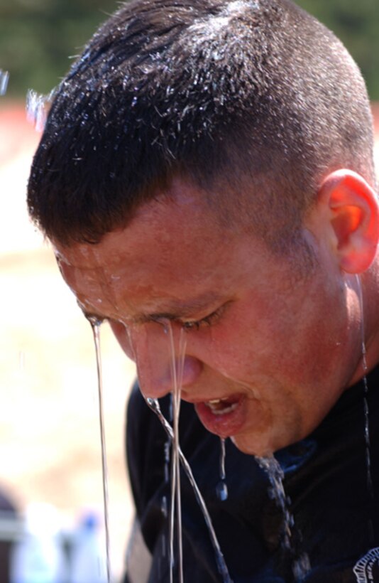 VANDENBERG AIR FORCE BASE, Calif. -- 2nd Lt. Jesse Goens takes a breath after finishing the obstacle course at Guardian Challenge here May 5.  Guardian Challenge, the world's premier space and missile competition, is an annual four-day event. It tests the wartime readiness of Air Force Space Command's Airmen in spacelift, ICBM operations, communications, maintenance, helicopter operations, security forces and food preparation.  Lieutenant Goens is assigned to the 90th Space Wing at F.E. Warren Air Force Base, Wyo.  (U.S. Air Force photo by Airman 1st Class Craig R. Cisek)