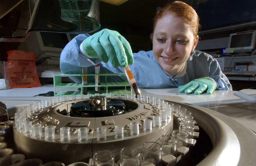 MAXWELL AIR FORCE BASE, Ala. -- Senior Airman Toni Bush of the 187th Medical Squadron loads a serum sample into a blood chemistry analyzer.  Airman Bush is an Air National Guardsman and is training with the 42nd Medical Group here.  (U.S. Air Force photo by Master Sgt. Lance Cheung)