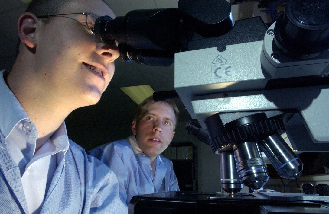 MAXWELL AIR FORCE BASE, Ala. -- Tech. Sgt. Michael Damron (right) reviews blood count procedures with Senior Airman Michael Thornton.  Both Airmen are assigned to the 42nd Medical Group here.  Each year, the people in the group's laboratory conduct more than 10,000 hematology tests.  The medical facility here is one of three that support processing for new Airmen.  (U.S. Air Force photo by Master Sgt. Lance Cheung)