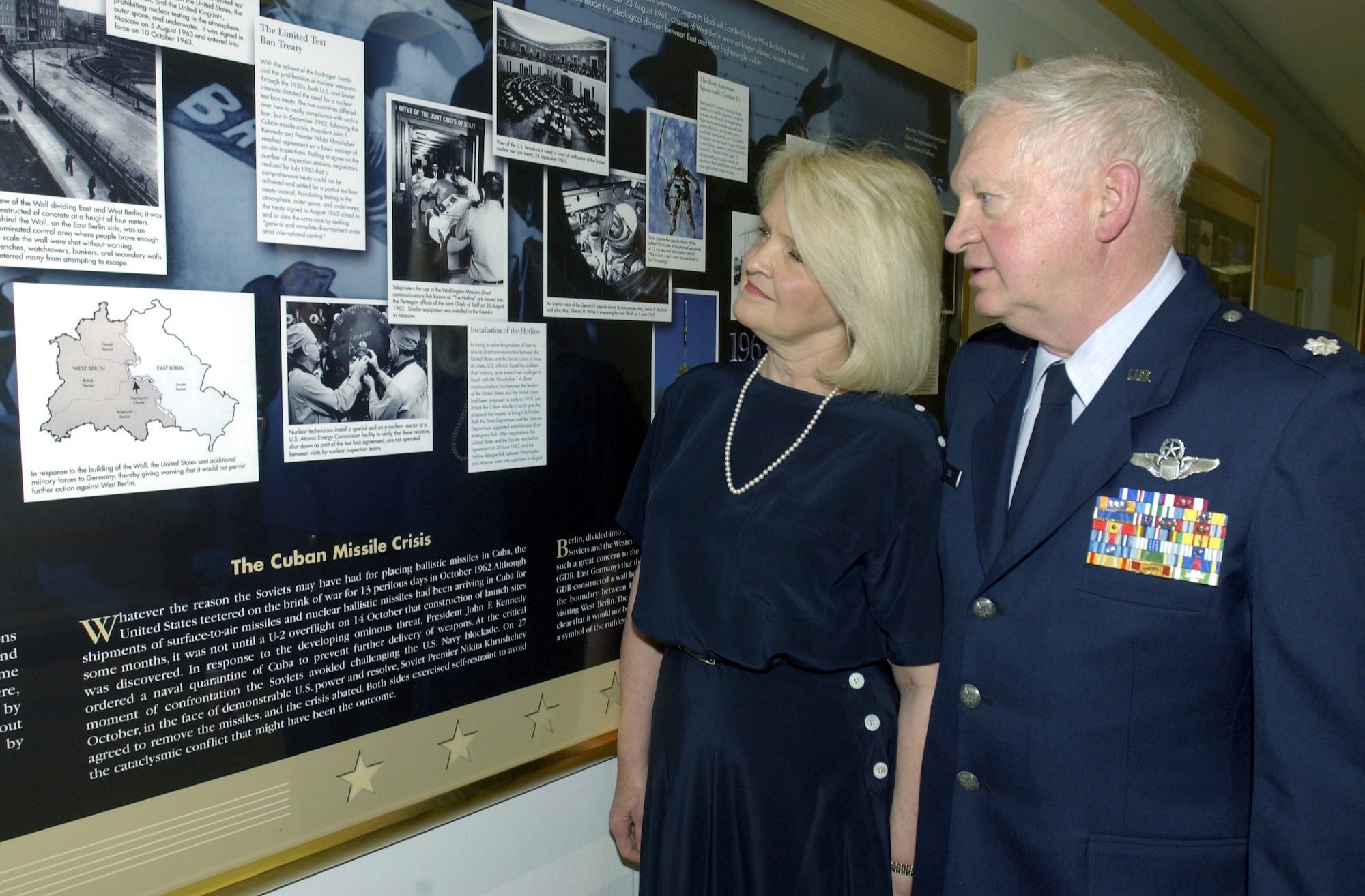 WASHINGTON -- Lt. Col. Theron Sims and his wife, Bonnie, look at a Cuban Missile Crisis display at the Pentagon.  Colonel Sims, who is on terminal leave for the second time, first joined the military as an enlisted Marine in 1962.  He retired from the Air Force in 1989 only to rejoin the service in 2002 as part of the Rated Officer Recall Program.  (U.S. Air Force photo by Master Sgt. Scott Elliott) 