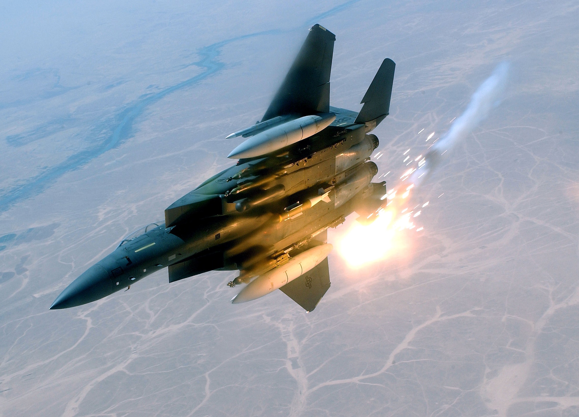SOUTHWEST ASIA- An F-15E Strike Eagle deployed from the 492nd Fighter Squadron at  Royal Air Force Lakenheath, England, pops flares during a combat sortie supporting Operation Iraqi Freedom here May 6.  (U.S. Air Force photo by Staff Sgt. Aaron Allmon II)            
