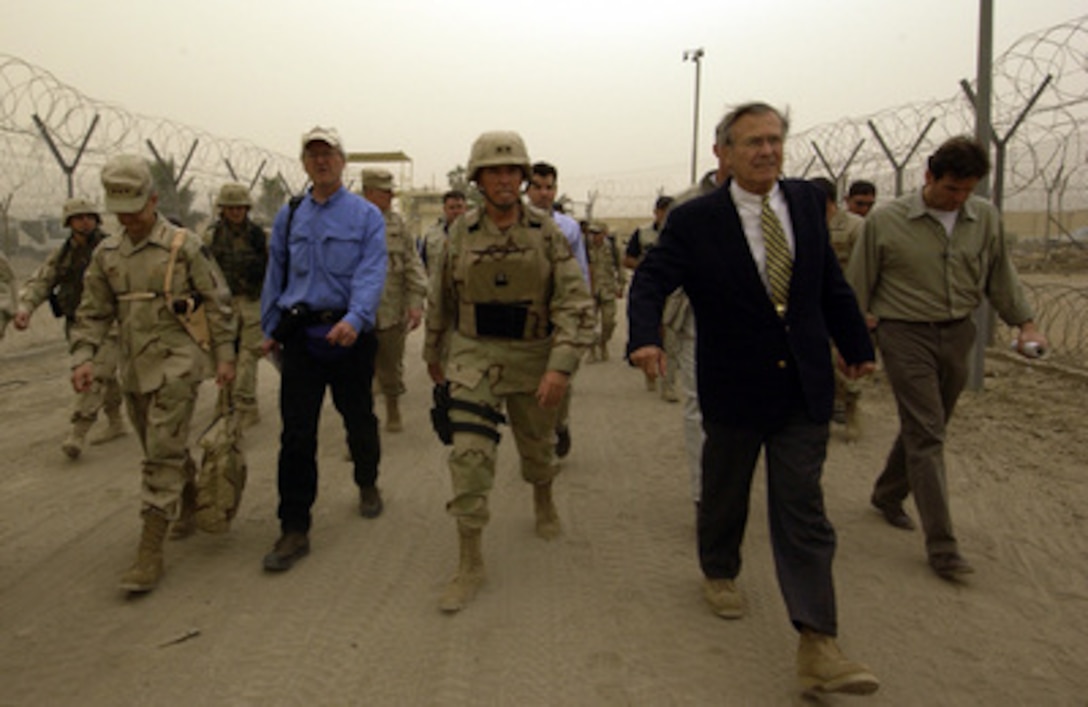 Secretary of Defense Donald H. Rumsfeld takes a tour of the Abu Ghraib Detention Center in Abu Ghraib, Iraq, on May 13, 2004. Rumsfeld and Chairman of the Joint Chiefs of Staff Gen. Richard B. Myers are in Iraq to visit the troops in Baghdad and Abu Ghraib. 