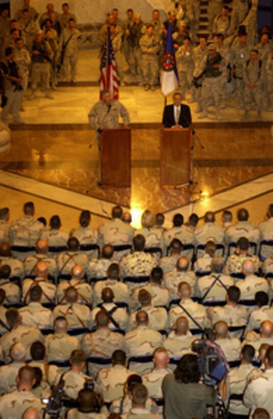 Chairman of the Joint Chiefs of Staff Gen. Richard B. Myers and Secretary of Defense Donald H. Rumsfeld talk to soldiers, Marines and airmen in the Al Faw Palace at Camp Victory, Iraq, on May 13, 2004. Rumsfeld and Myers are in Iraq to visit the troops in Baghdad and Abu Ghraib. 