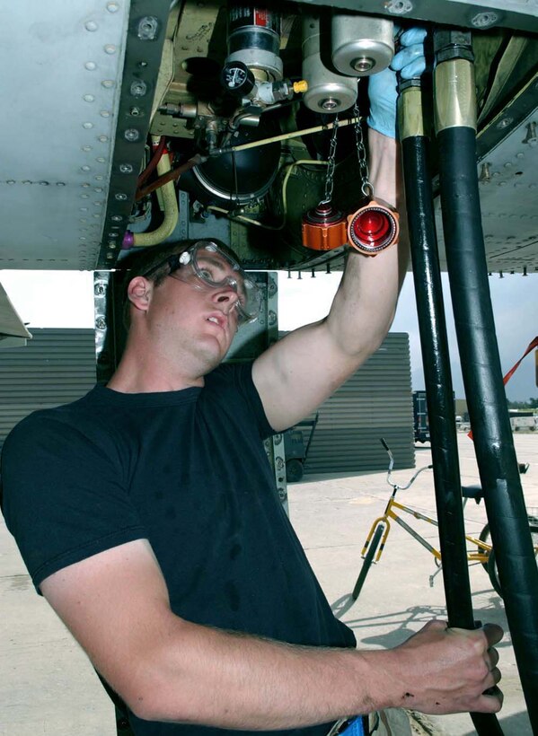BAGRAM AIR BASE, Afghanistan -- Staff Sgt. Shaun Loeffler hooks up a hydraulic test stand to an A-10 Thunderbolt II here.  The stand is used to check the aircraft's flight control system.  Sergeant Loeffler is crew chief assigned to the 455th Expeditionary Aircraft Maintenance Squadron and is deployed from Eielson Air Force Base, Alaska.  (Air Force Photo by Master Sgt. Jeff Szczechowski)                    