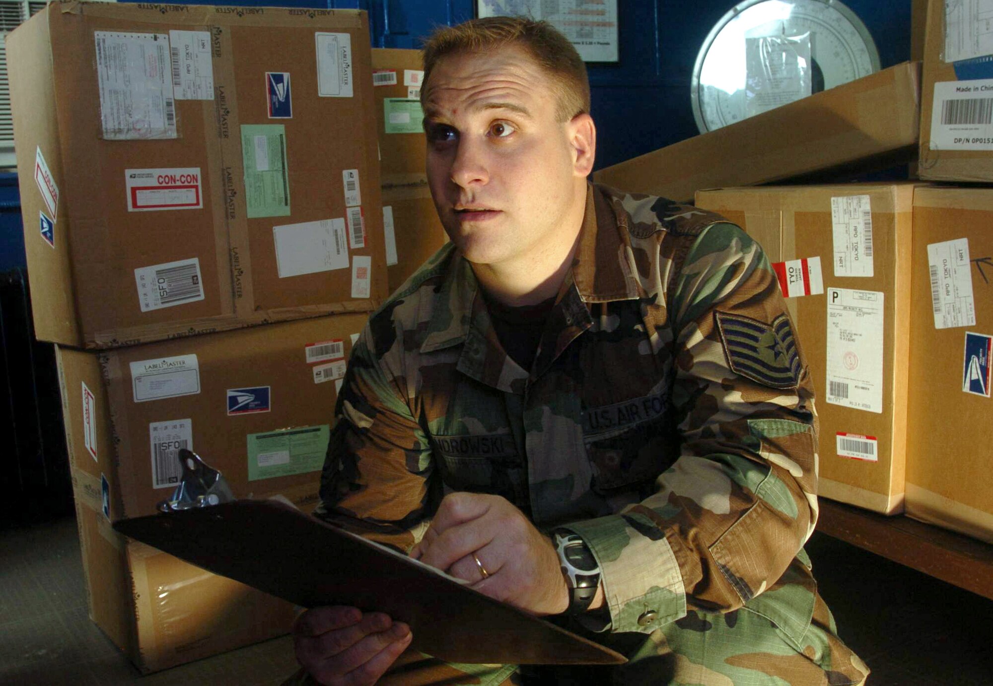 YOKOTA AIR BASE, Japan -- Tech. Sgt. Richard Cendrowski inspects packages at the mail processing facility here ensuring they have the proper markings before shipment.  He is assigned to Detachment 2 of the Air Postal Squadron.  The detachment oversees the movement, sorting and distribution of more than 50 million pounds of mail annually.  (U.S. Air Force photo by Master Sgt.Val Gempis)