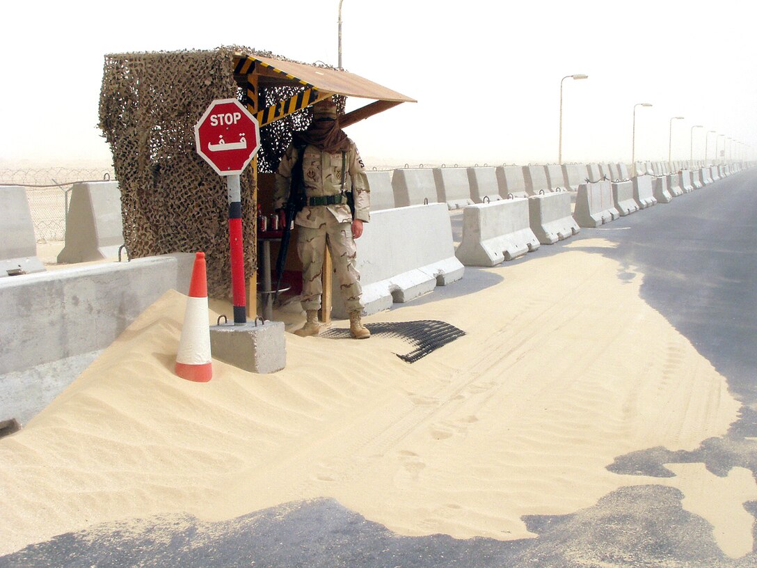 SOUTHWEST ASIA -- Airman 1st Class Jayson Sterling guards an entry-control point at a forward-deployed location during a sand storm.  Airman Sterling is assigned to the 379th Expeditionary Security Forces Squadron and is deployed from Wright-Patterson Air Force Base, Ohio.  (U.S. Air Force photo by Senior Airman Wes Auldridge)