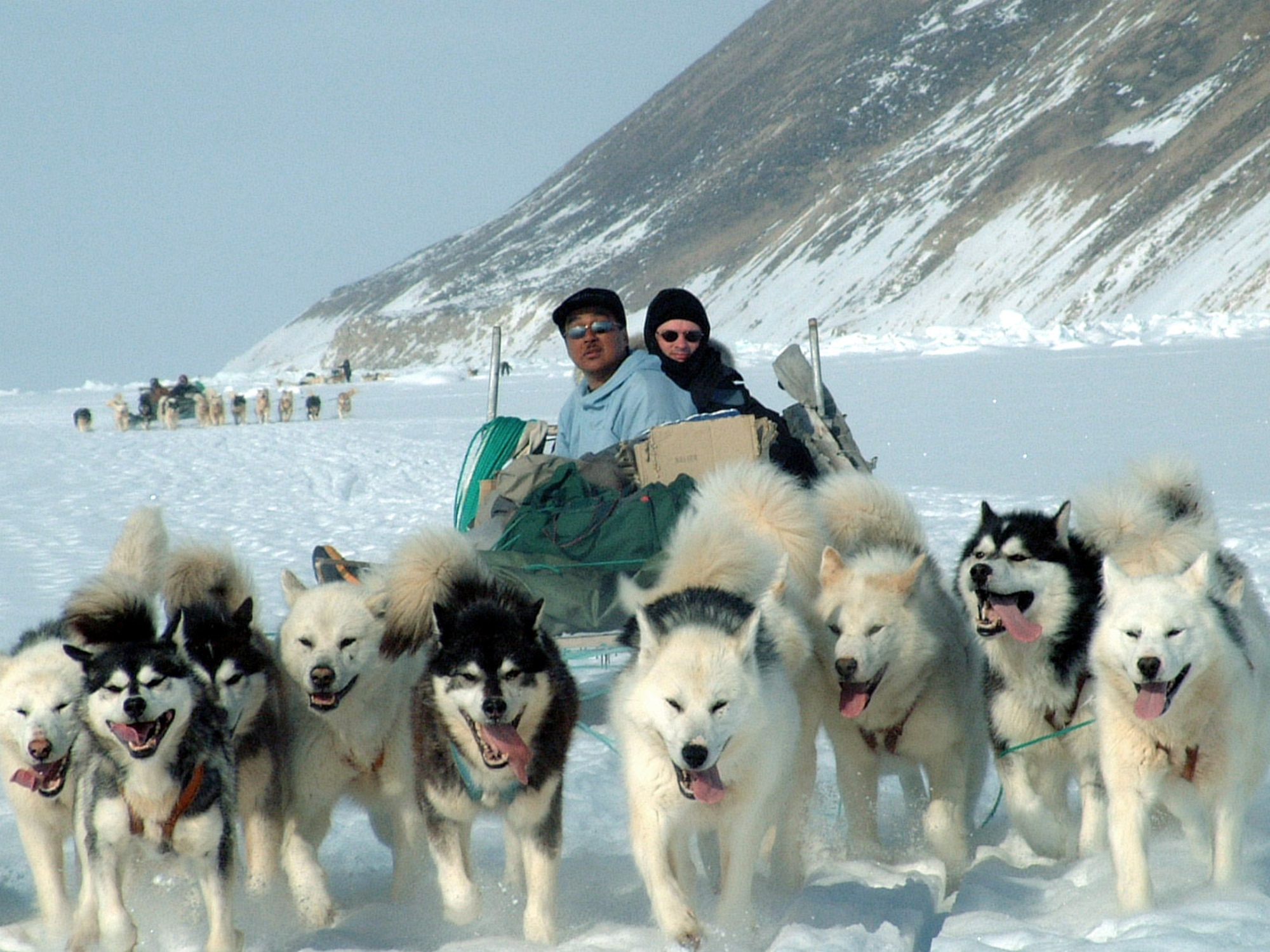 GREENLAND -- Otto (left) and 1st Lt. Lance Brenneke head toward home after a six-day dog-sledding expedition in northwest Greenland.  Otto is a Greenlandic hunter, and Lieutenant Brenneke is assigned to the 821st Support Squadron at Thule Air Force Base, Greenland.  (U.S. Air Force photo by Tech. Sgt. Dan Rea)