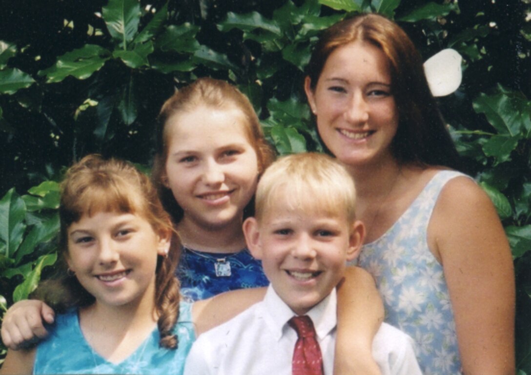 LANGLEY AIR FORCE BASE, Va. -- (From left) Hannah, Irena, Edgor and Catherine pose for a photo during the summer of 2003.  Hannah and Catherine are the daughters of Tech. Sgt. Mike and Brenda Kelly of the 1st Component Maintenance Squadron here.  The Kellys invited Irena and Edgor, who are affected by contamination from the Chernobyl accident, to visit with them each summer.  (Courtesy photo)