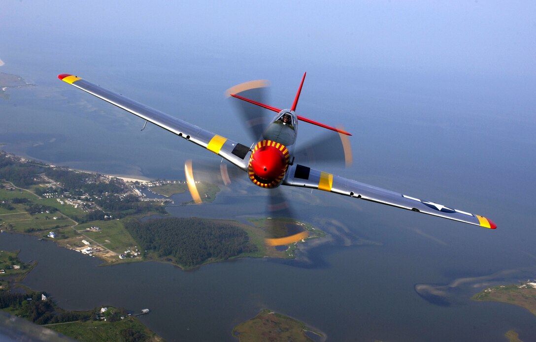 OVER VIRGINA -- Ed Shipley flies a P-51 Mustang in a heritage flight during an air show at Langley Air Force Base, Va., on May 21.  (U.S. Air Force photo by Tech. Sgt. Ben Bloker)