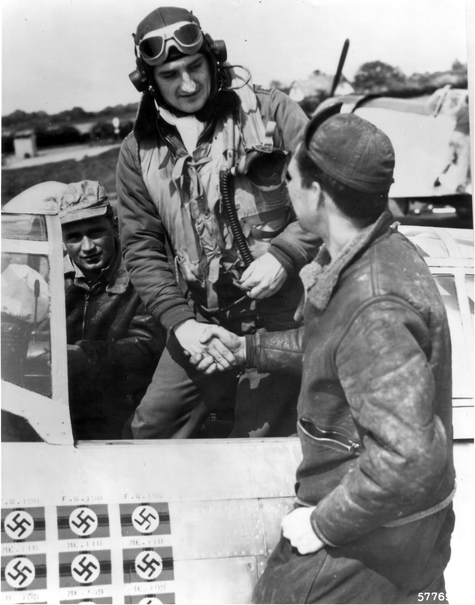 1940's -- Lt. Col. Frances S. Gabreski and Staff Sgt. Ralph Safford, crew chief, prepare for flight. The assistant crew chief is in the background.