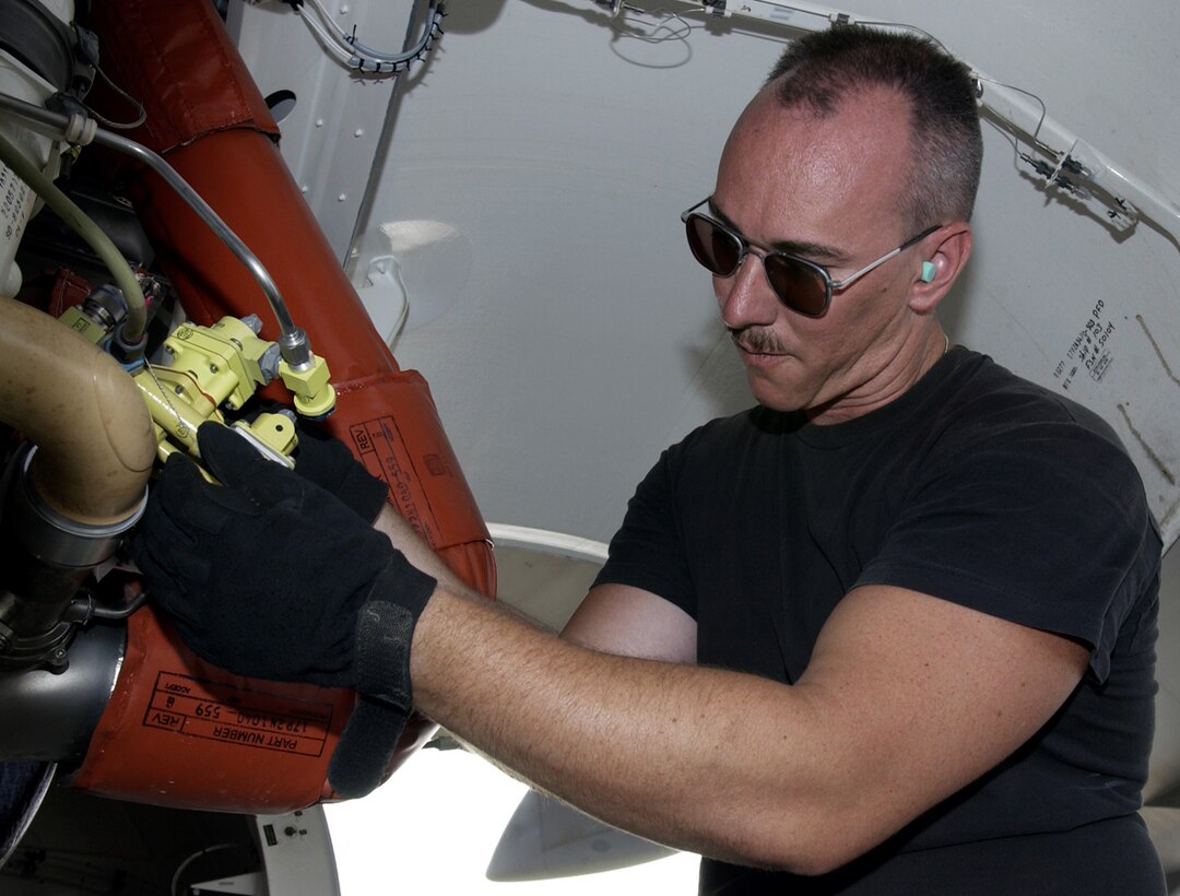 SOUTHWEST ASIA -- Tech. Sgt. J.J. Saffell works on a C-17 Globemaster III air-conditioning pack.  The 8th Expeditionary Air Mobility Squadron Airmen handle about 1,900 aircraft missions monthly.  Sergeant Saffell is assigned to the strategic maintenance section and is deployed from McChord Air Force Base, Wash.  (U.S. Air Force photo by Tech. Sgt. Demetrius Lester)