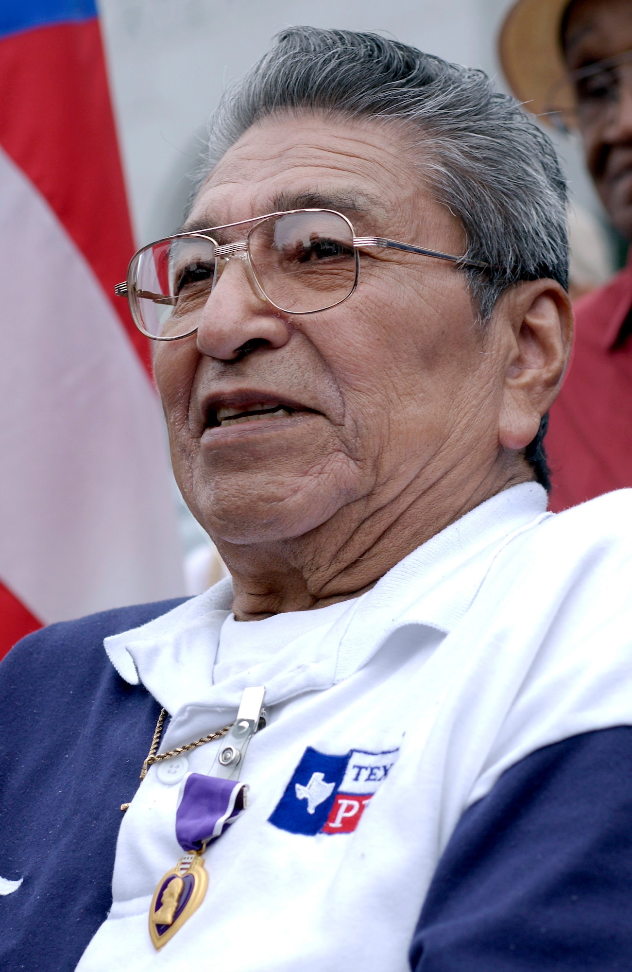 WASHINGTON -- World War II veteran John Martinez was presented a Purple Heart on May 28 at the World War II Memorial here more than 59 years after his A-20 attack bomber crashed near Rhiems, France, causing a paralyzing spinal-cord injury.  Mr. Martinez was a staff sergeant serving as an aerial gunner on the A-20.  (U.S. Air Force photo by Master Sgt. Jim Varhegyi)