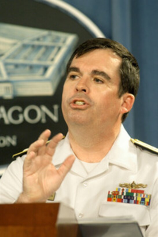 Program Executive Officer for Ships at the Naval Sea Systems Command Rear Adm. Charles Hamilton II clarifies some technical details concerning the Navy's new Littoral Combat Ship program during a Pentagon press conference on May 27, 2004. Hamilton and Assistant Secretary of the Navy for Research, Development and Acquisition John Young briefed reporters on the new class of surface combat vessels designed to operate in and help dominate the near-land battle space. Young announced the awarding of contracts to Lockheed Martin Corporation, Maritime Systems & Sensors in Moorestown, N.J., and General Dynamics' Bath Iron Works in Bath, Maine, to produce two prototype ships each. These ships will be extensively tested before further contracts for production versions are awarded. 