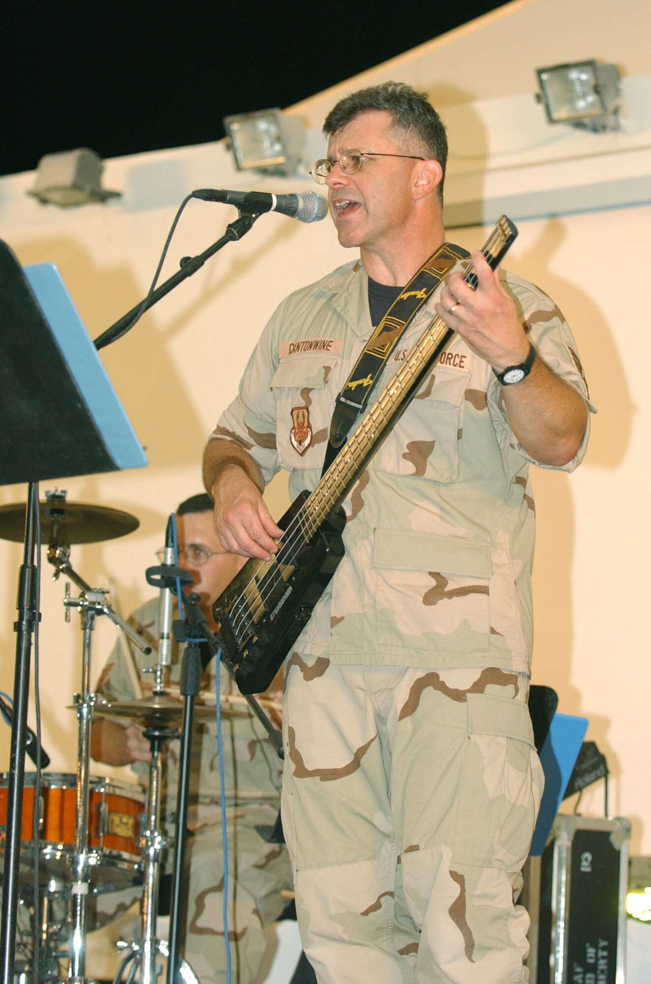 SOUTHWEST ASIA -- Tech. Sgt. Guy Cantonwine performs during a U.S. Air Force Band of Mid-America's show here.  The show was among several in the Middle East as part of the band's tour during its first air and space expeditionary force deployment.  (U.S. Air Force photo by Airman 1st Class Chad Trujillo)
