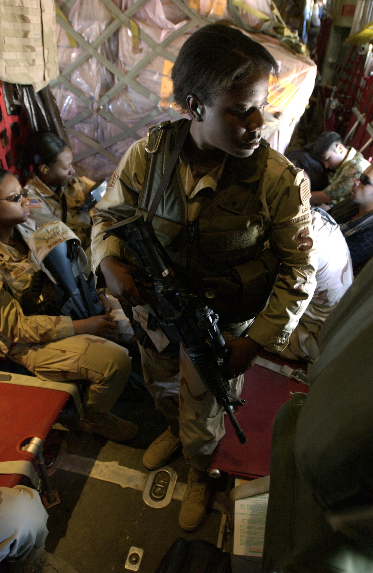 KARSHI-KHANABAD AIR BASE, Uzbekistan -- Staff Sgt. Erica Cummings is one of the two &quot;fly-away&quot; security forces Airmen who accompany people and cargo being moved to various &quot;high-risk&quot; landing zones throughout Southwest Asia.  (U.S. Air Force photo Master Sgt. Scott Wagers)
