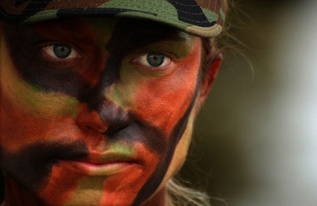 U.S. Air Force Staff Sgt. Sally McCabe awaits inspection prior to the combat weapons portion of Defender Challenge 2004 at Lackland Air Force Base, Texas, on Oct. 24, 2004. Defender Challenge is a competition setting security forces from major commands against one another in a series of marksmanship, tactics, and physical fitness events. McCabe is assigned to the 85th Security Forces Squadron, Keflavik Air Base, Iceland. 
