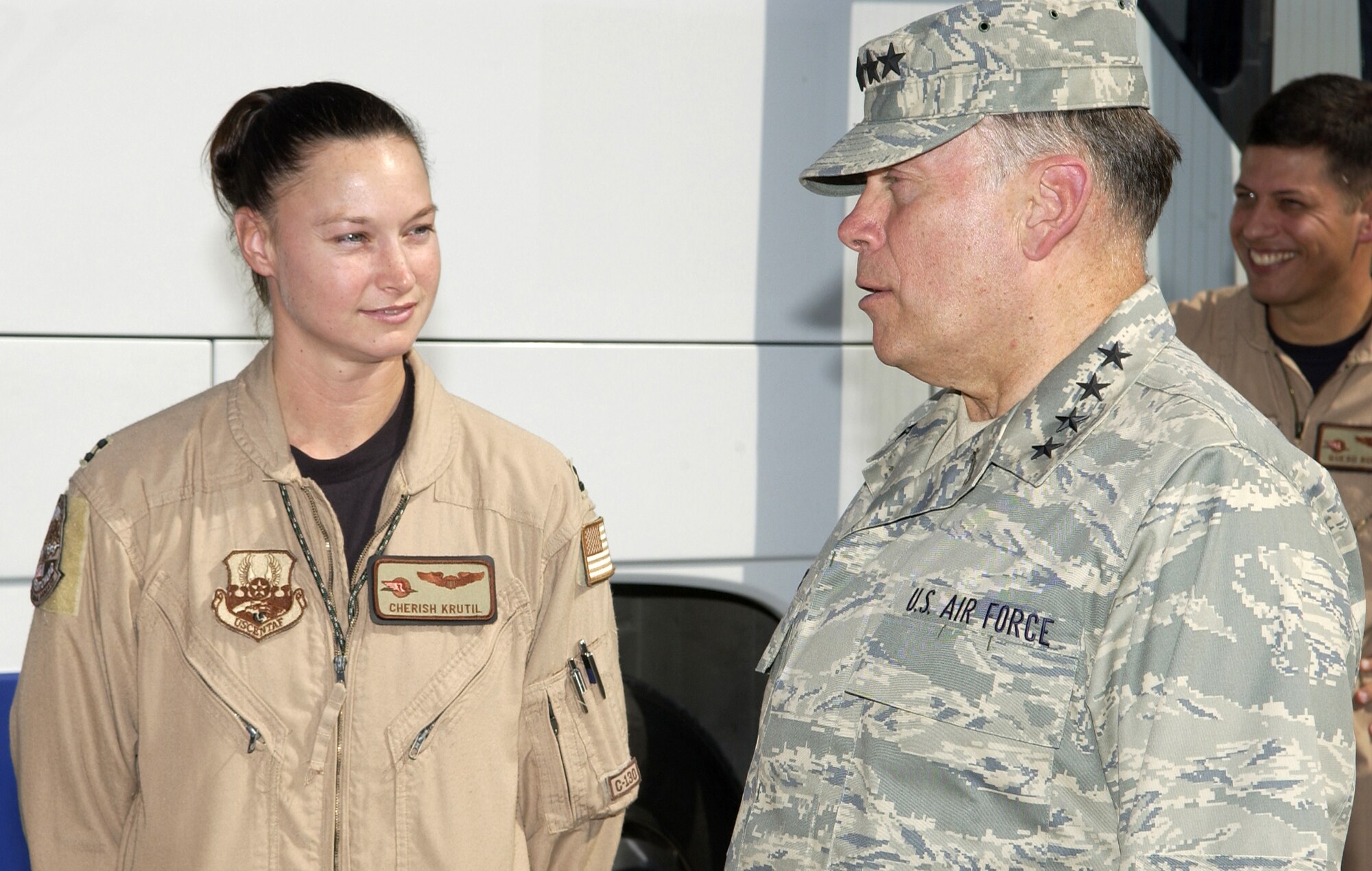 SOUTHWEST ASIA -- Air Force Chief of Staff Gen. John P. Jumper speaks with Capt. Cherish Krutil from the 745th Expeditionary Airlift Squadron at a forward-deployed location Nov. 4.  The general, Secretary of the Air Force Dr. James G. Roche and Chief Master Sgt. of the Air Force Gerald R. Murray are traveling the area visiting deployed Airmen.  (U.S. Air Force photo by Tech. Sgt. Travis Aston)

