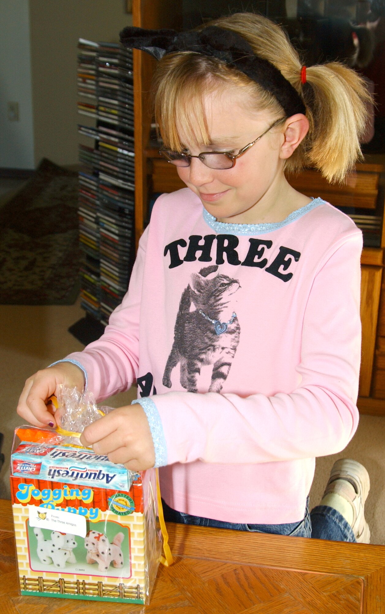 TORRANCE, Calif. -- Sydney Beres puts the finishing touch on a gift pack for the children at Harbor UCLA Medical Center here.  Sydney is one of the "Three Amigos" who have raised more than $400 for gifts to take to children in local hospitals.  (Courtesy photo)

