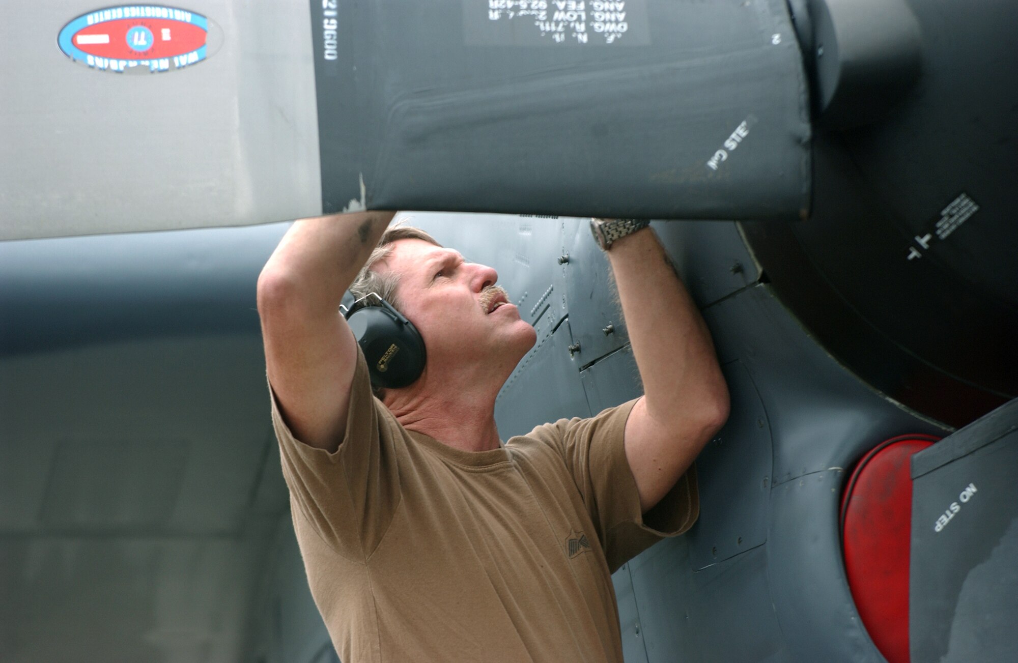 PUNTA DEL ESTE, Uruguay -- Master Sgt. Bill McIntyre performs preventive maintenance on the engines of an MC-130P Combat Shadow while on temporary duty here supporting Unitas 2004.  The exercise involves navies from the United States, Spain, Brazil, Uruguay and Argentina, plus the U.S. Coast Guard and U.S. Air Force.  Sergeant McIntyre is assigned to the 5th Special Operations Squadron at Eglin Air Force Base, Fla.  (U.S. Air Force photo by Master Sgt. Bill Kimble) 