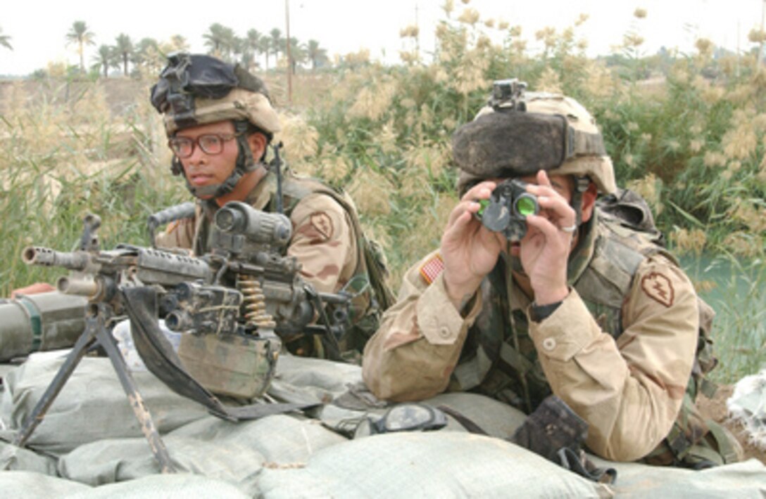 U.S. Army soldiers man a traffic control point outside the Fallujah suburb of Al Kharma, Iraq, on Nov. 8, 2004. The troops at the control point are controlling the flow of people trying to leave, and screening to prevent militant escape. The soldiers are assigned to Bravo Company, 1st Battalion, 5th Infantry Regiment, Stryker Brigade. 