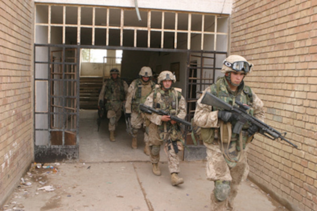 U.S. Marines seize apartments at the edge of Fallujah, Iraq, in the first hours of Operation al Fajr (New Dawn) on Nov. 8, 2004. The Marines are assigned to K Company, 3rd Battalion, 5th Marine Regiment, 1st Marine Division that is engaged in security and stabilization operations in the Al Anbar Province of Iraq. 