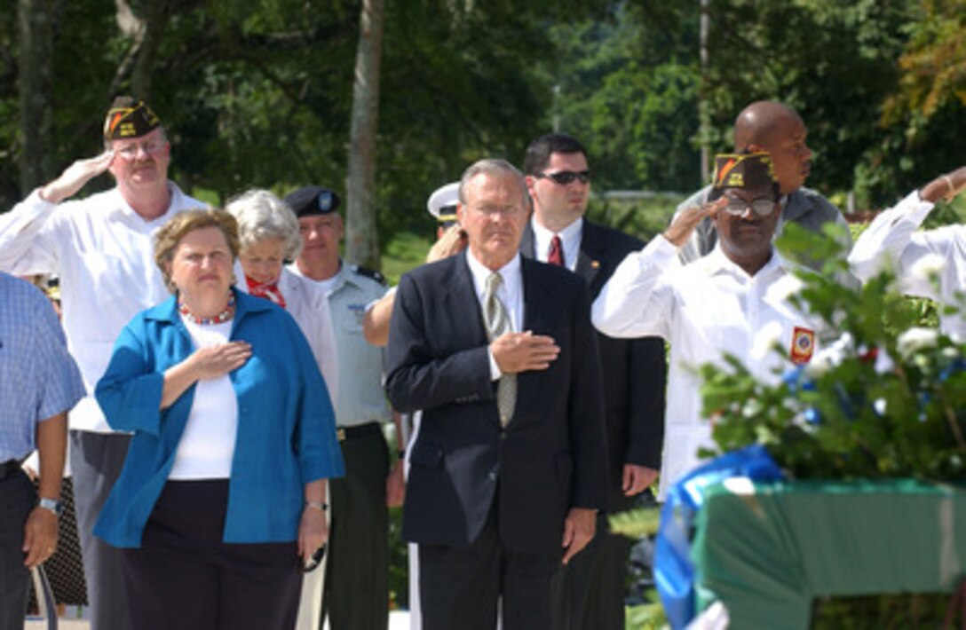 Secretary of Defense Donald H. Rumsfeld and Veterans of Foreign Wars salute during a wreath laying ceremony at Panama's Corozal Cemetery on Nov. 14, 2004. Rumsfeld is in Panama to meet with Panamanian President Martin Torrijos and show his support for the regional naval cooperation (Enduring Friendship) and regional cooperation in securing the Panama Canal from terrorist attack. Rumsfeld and 33 more defense ministers from throughout the Western Hemisphere will assemble in Quito, Ecuador, on November 15th for the Defense Ministerial of the Americas conference which will focus on strengthening the inter-American security system. 