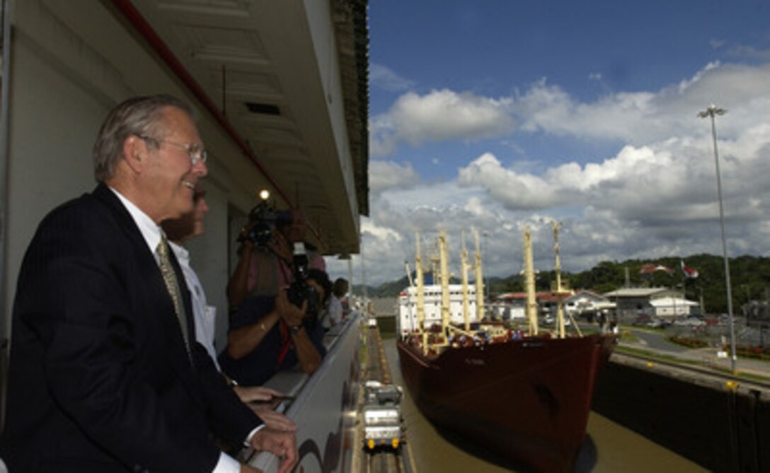 Secretary of Defense Donald H. Rumsfeld watches a ship transit the Miraflores Lock in the Panama Canal on Nov. 14, 2004. Rumsfeld is in Panama to meet with Panamanian President Martin Torrijos and show his support for the regional naval cooperation (Enduring Friendship) and regional cooperation in securing the Panama Canal from terrorist attack. Rumsfeld and 33 more defense ministers from throughout the Western Hemisphere will assemble in Quito, Ecuador, on November 15th for the Defense Ministerial of the Americas conference which will focus on strengthening the inter-American security system. 
