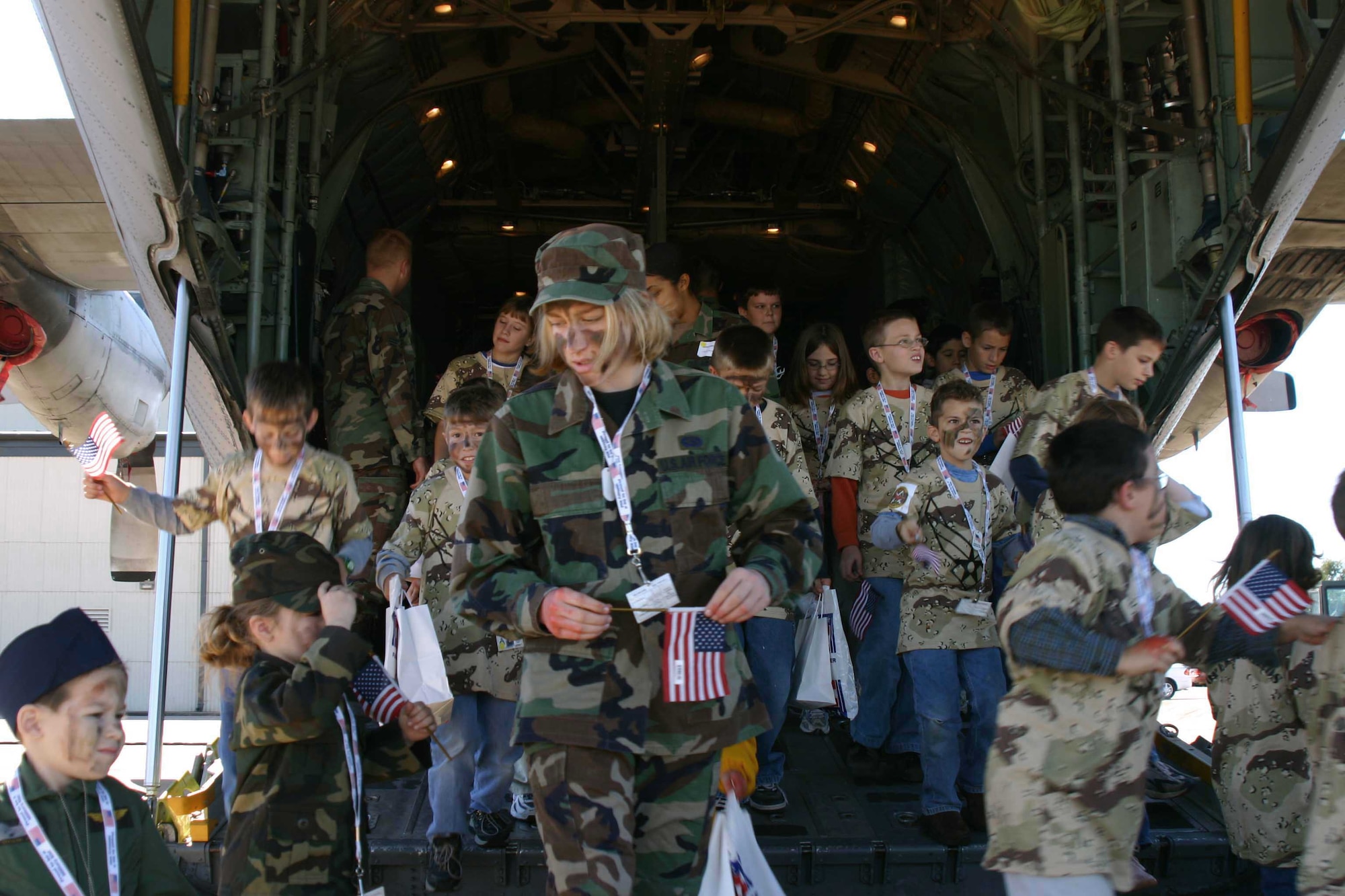 SHEPPARD AIR FORCE BASE, Texas -- Children climb off a C-130 Hercules after returning from a "deployment."  Operation Kids Investigating Deployment Services gave children an opportunity to see what their parents go through during a deployment.  (U.S. Air Force photo by Airman 1st Class Jacque Lickteig)