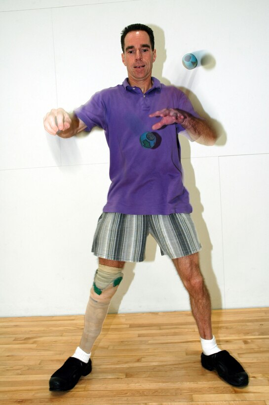 OSAN AIR BASE, South Korea -- Juggling is one of many fitness activities Terry Mallon does nearly every day.  His prosthetic leg does not slow his pursuit of fitness and sports.  He is an Army and Air Force Exchange Service security technician.  (U.S. Air Force photo by Staff Sgt. Russell Wicke)