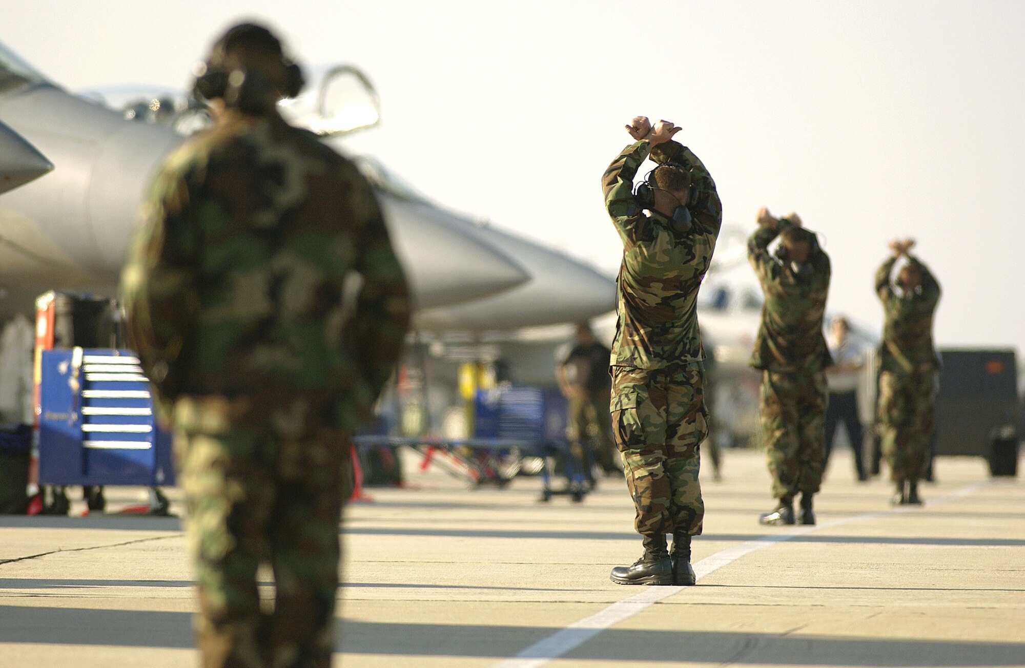 TYNDALL AIR FORCE BASE, Fla. -- Several crew chiefs from the 19th Fighter Squadron at Elmendorf Air Force Base, Alaska, marshal F-15 Eagles during William Tell 2004 here.  This is the 50th anniversary of the William Tell competition that tests an aircrew's ability to perform under combat conditions.  (U.S. Air Force photo by Staff Sgt. Colette Bennett)