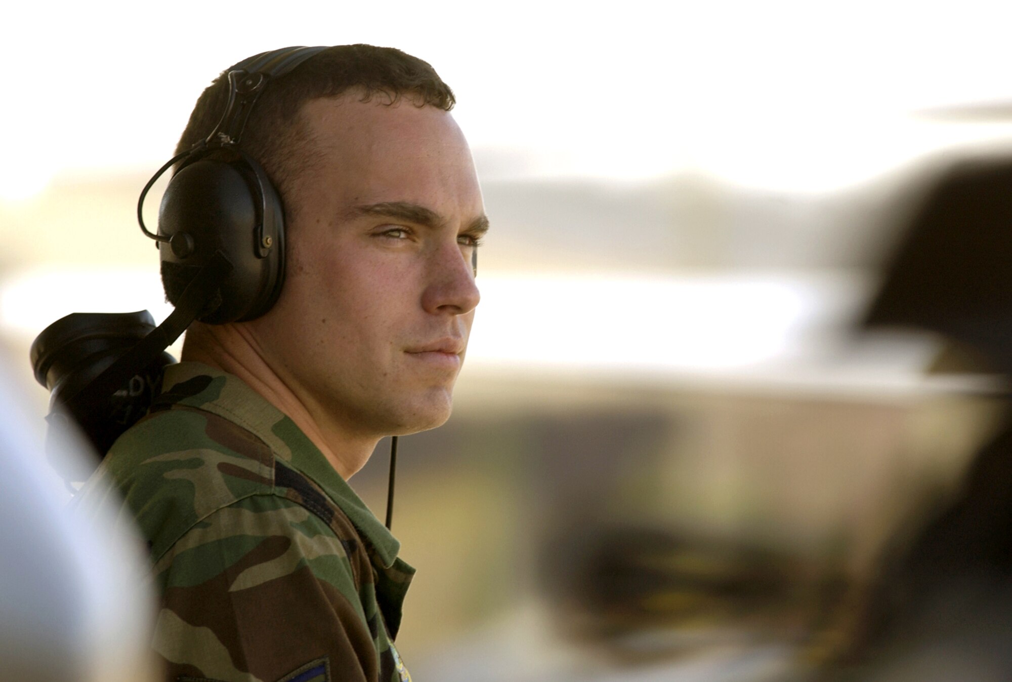 TYNDALL AIR FORCE BASE, Fla. -- Senior Airman Nicholas Hofmann watches F-15 Eagles taxi for a competition here at William Tell 2004.  This is the 50th anniversary of the William Tell competition, which tests an aircrew's ability to perform under combat conditions.  Airman Hofmann is from the 493rd Fighter Squadron at Royal Air Force Lakenheath, England.  (U.S. Air Force photo by Staff Sgt. Colette Bennett)