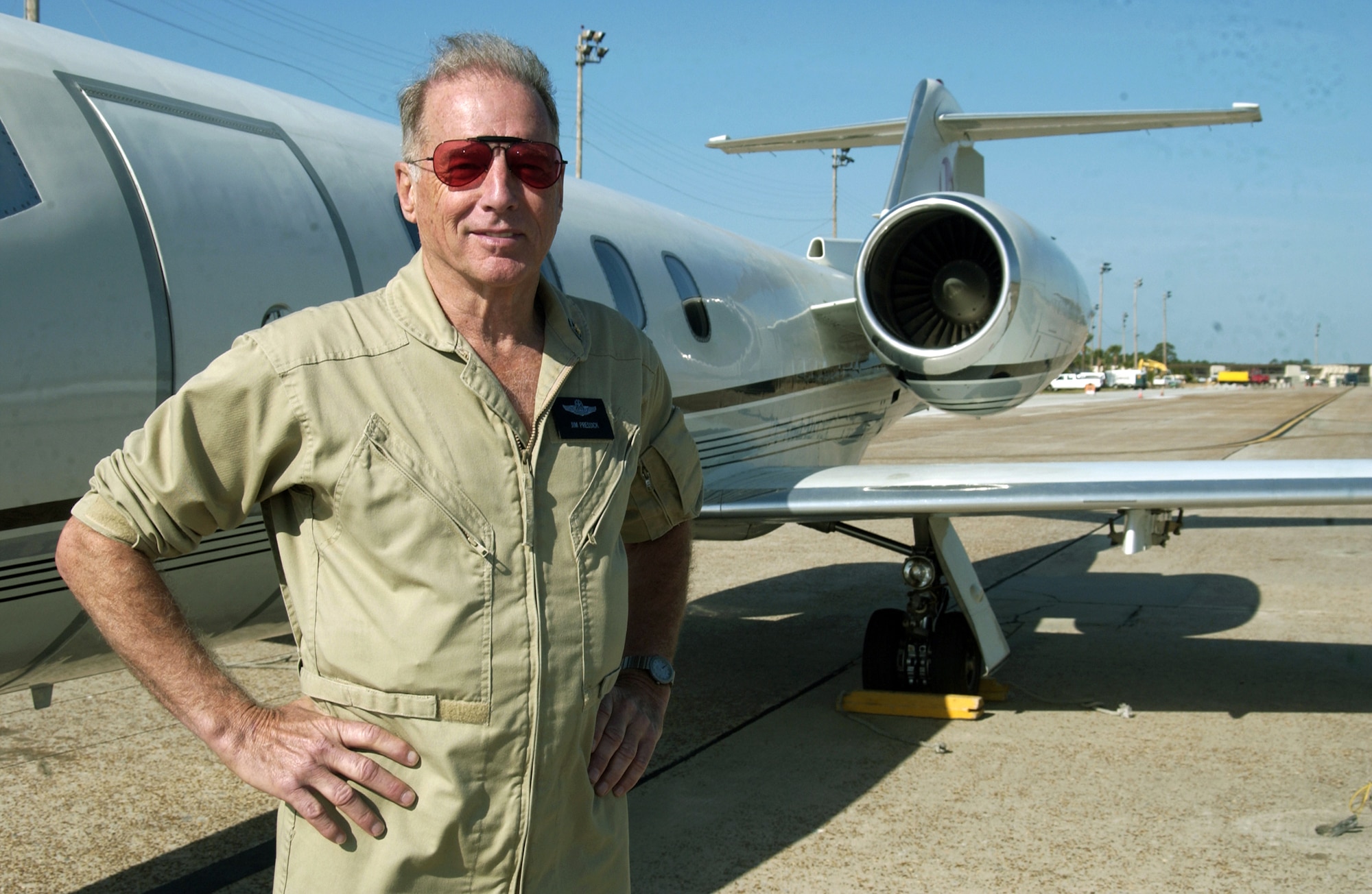 TYNDALL AIR FORCE BASE, Fla. -- Retired Lt. Col. Jim Presick stands by a Learjet here Nov. 15.  Colonel Presick tows a banner some 2,000 feet behind the jet as a target for F-15 Eagle pilots competing in William Tell 2004.  This is the 50th anniversary of the William Tell competition, which tests an aircrew's ability to perform under combat conditions.  Colonel Presick is a contractor from Newsport News, Va.  (U.S. Air Force photo by Tech. Sgt. Scott M. Ash)