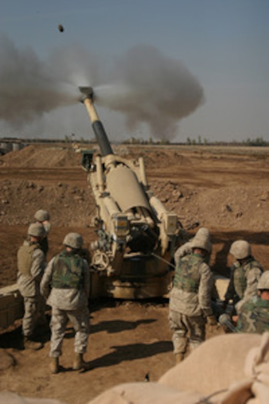 U.S. Marines fire their 155mm M198 Medium Howitzer on an insurgent position from the outskirts of Fallujah, Iraq, during Operation al Fajr (New Dawn) on Nov. 11, 2004. The Marines are assigned to 4th Battalion, 14th Marine Regiment. 