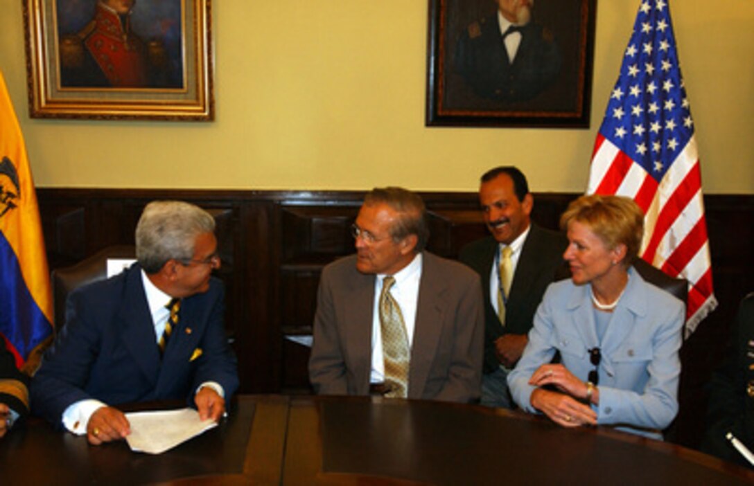 Ecuadorian Minister of Defense Nelson Herrera (left) meets with Secretary of Defense Donald H. Rumsfeld (center) and U.S. Ambassador to Ecuador Kristie Kenney in Quito, Ecuador, on Nov. 16, 2004. Rumsfeld and 33 more defense ministers from throughout the Western Hemisphere are assembling in Quito to attend the Defense Ministerial of the Americas conference that will focus on strengthening the inter-American security system. 
