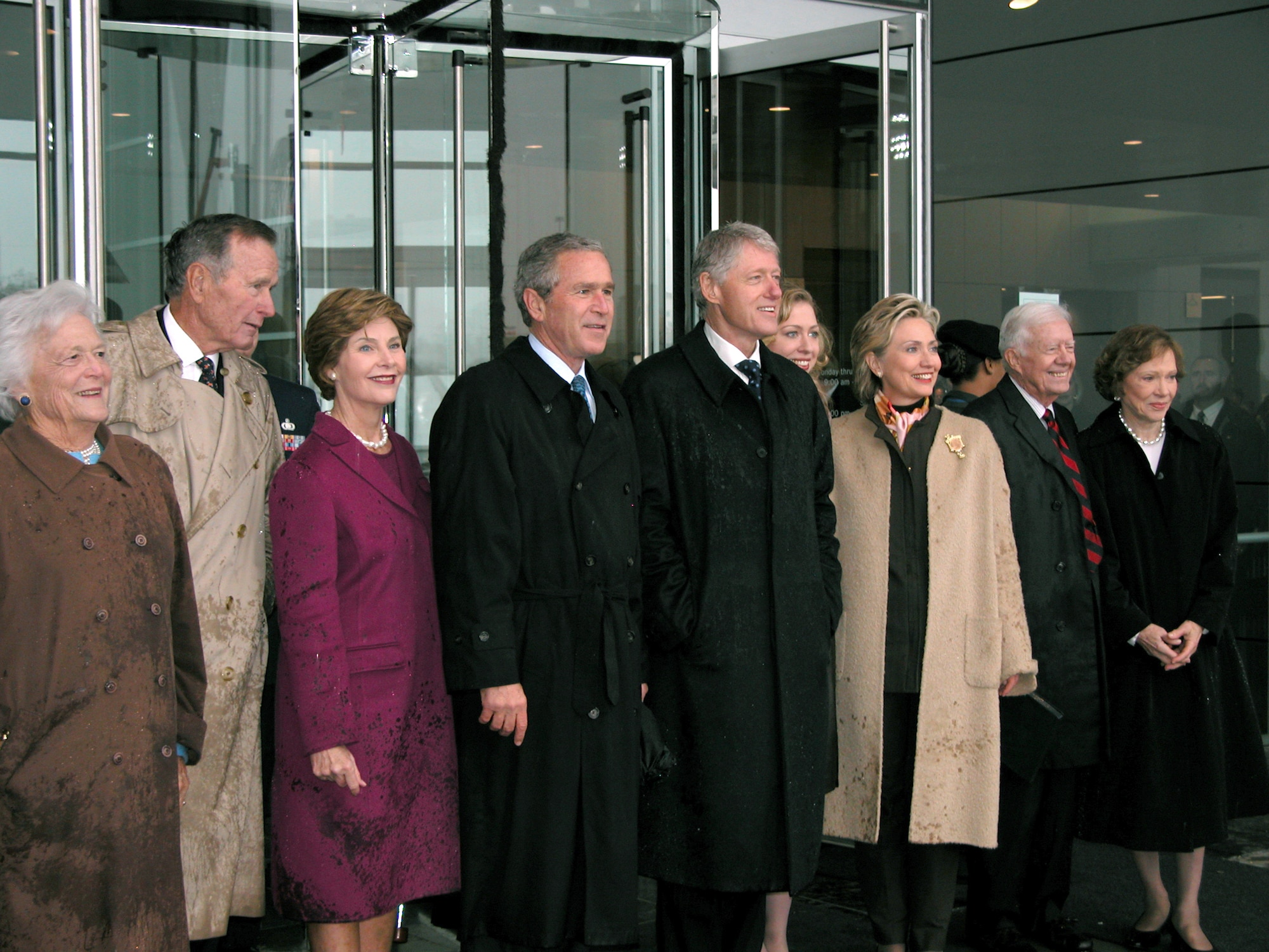 LITTLE ROCK, Ark. -- (From left) Barbara Bush, George H.W. Bush, Laura Bush, President George W. Bush, Bill Clinton, Chelsea Clinton, Hillary Clinton, Jimmy Carter and Rosalynn Carter pose for the media after the William J. Clinton Presidential Library opening ceremonies.  (U.S. Air Force photo by Tech. Sgt. Bob Oldham)
