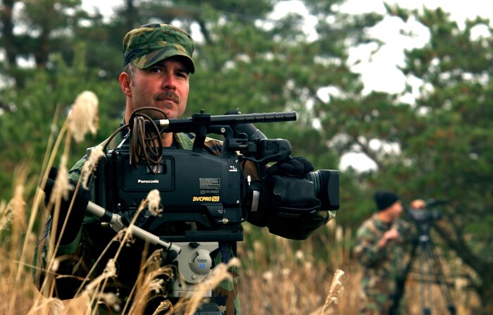 NEAR CAMP IWATA, Japan -- Tech. Sgt. Chris Scrivener prepares to document a tactical insertion of U.S. Army infantrymen as part of Operation Orient Shield here recently.  Operation Orient Shield is a bilateral training exercise with the Japan Ground Self Defense Force. Sergeant Scrivener is a videographer assigned to the 1st Combat Camera Squadron at Charleston Air Force Base, S.C.  (U.S. Air Force photo by Staff Sgt. Cherie A. Thurlby) 