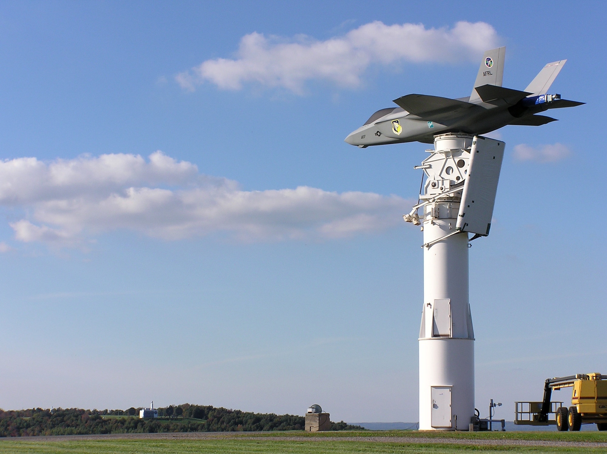 NEWPORT, N.Y. -- A full-scale F-35 Joint Strike Fighter model is perched atop a pedestal overlooking a rural valley in central New York.  Engineers from the Air Force Research Laboratory's antenna research and measurement facility here are testing the aircraft's sophisticated antenna.  The model weighs 8,500 pounds and has the capability to simulate all three variants of the fighter.  (Courtesy photo)      
