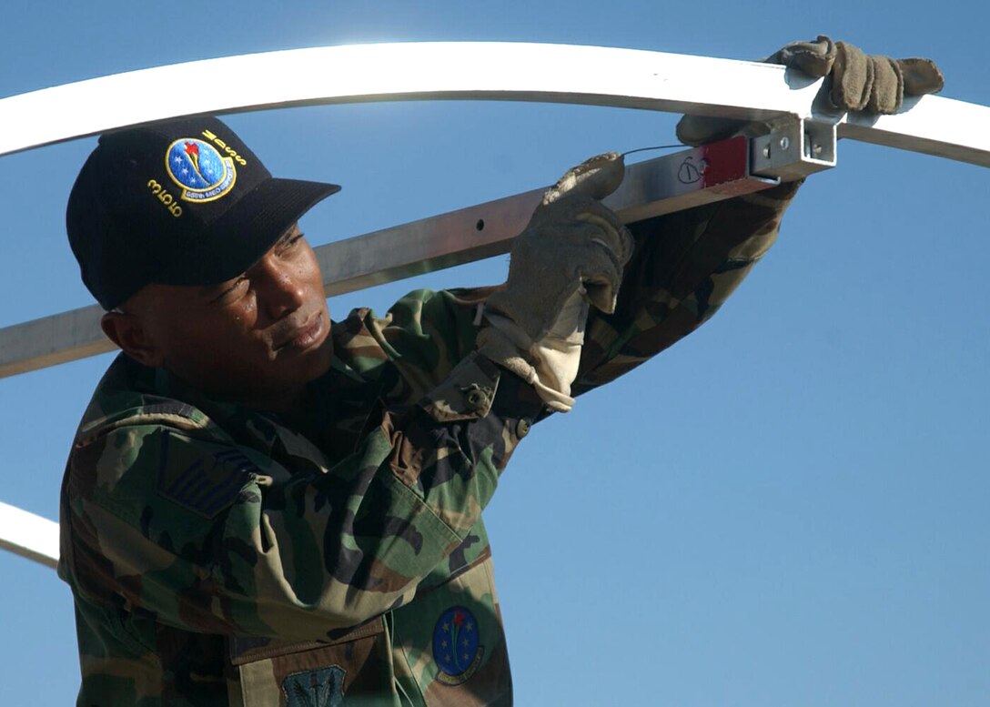 DAVIS-MONTHAN AIR FORCE BASE, Ariz. -- Master Sgt. James Green helps erect an Alaskan shelter that is used for patient care at deployed locations.  Airmen train like this quarterly to prepare for deployment.  Sergeant Green is the superintendent of the 355th Medical Support Squadron here.  (U.S. Air Force photo by Airman 1st Class Christina D. Kinsey)