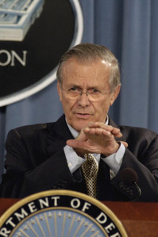 Secretary of Defense Donald H. Rumsfeld responds to a reporter's question during a Pentagon press briefing on Nov. 23, 2004. Rumsfeld was joined by Chairman of the Joint Chiefs of Staff Gen. Richard B. Myers, U.S. Air Force. 