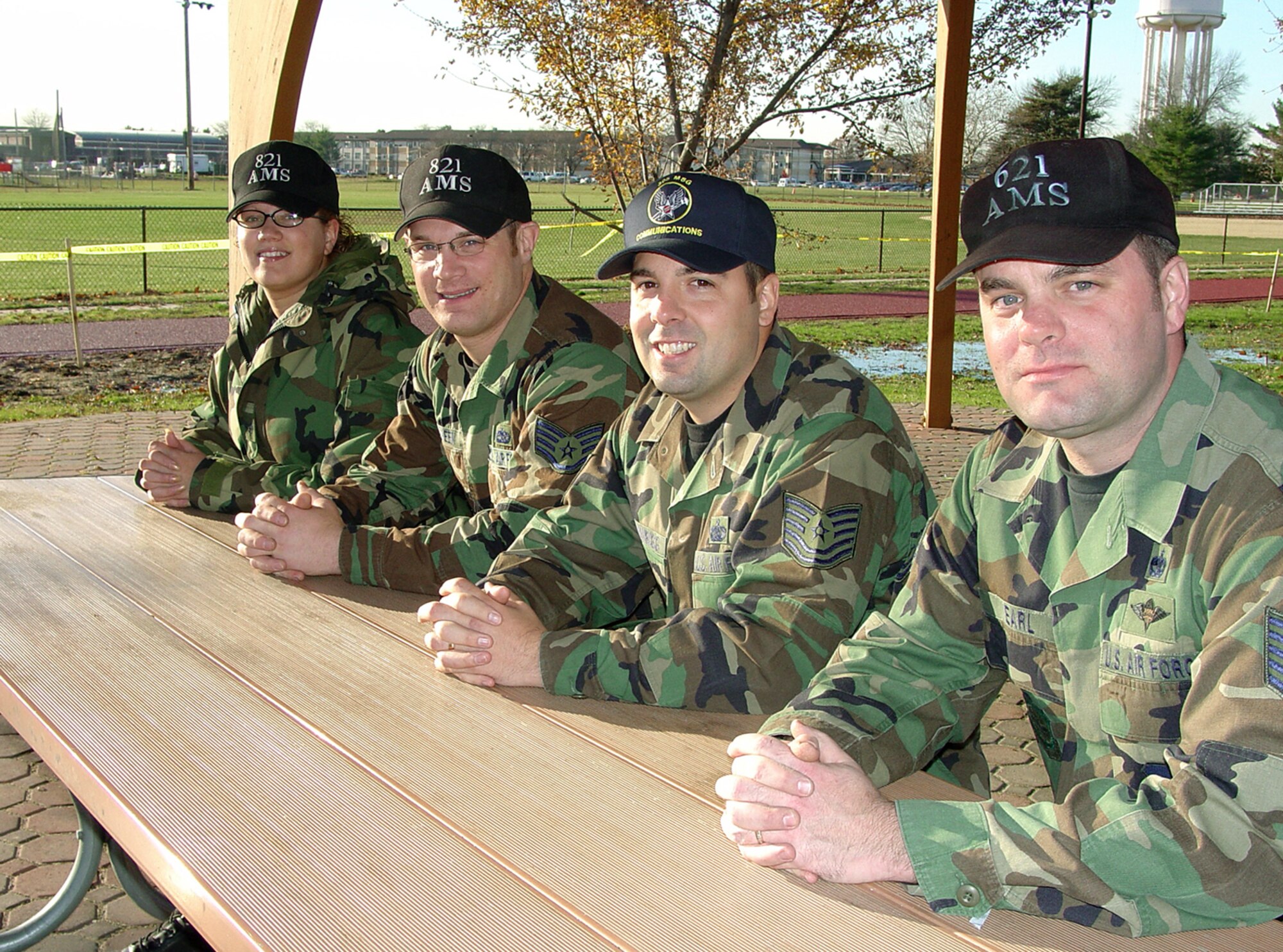 MCGUIRE AIR FORCE BASE, N.J. -- (From left) Senior Airman Sarah Gonzalez, Staff Sgt. Joseph Maneen, and Tech. Sgts. Scott Brownrigg and Shane Earl are all natives of Ilion, N.Y., stationed here.  Airman Gonzalez and Sergeant Maneen are assigned to the 821st Air Mobility Squadron, Sergeant Earl is assigned to the 621st AMS, and Sergeant Brownrigg is assigned to the 305th Communications Squadron.  Maj. Donald Brien (not pictured), of the 821st AMS, is also from Ilion.  (U.S. Air Force photo by Airman 1st Class Ashley Casas)