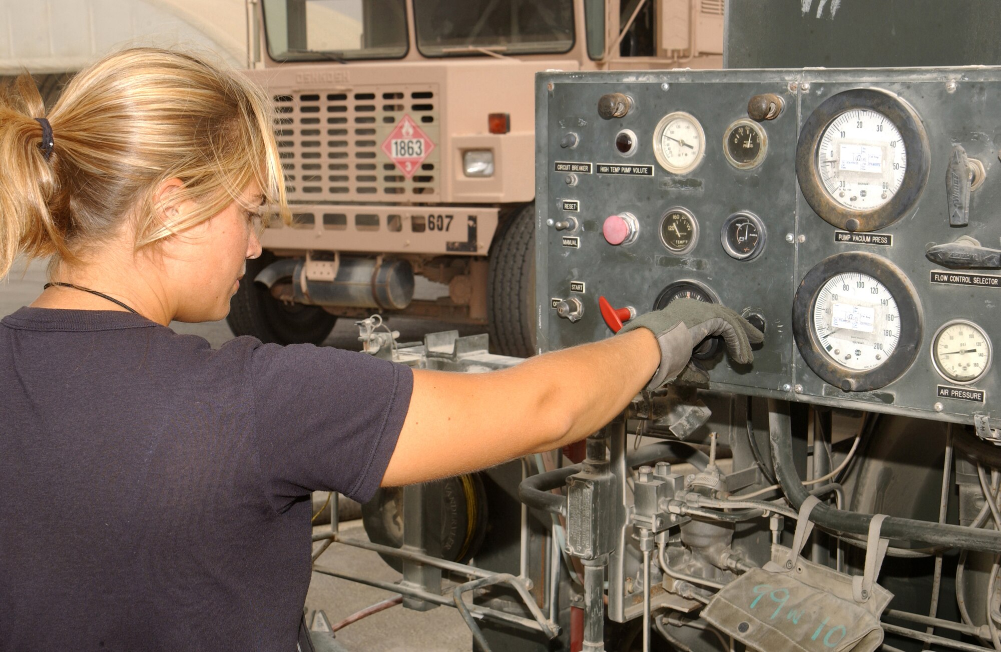 SOUTHWEST ASIA -- Airman 1st Class Holly Cather fills a fuel truck from a portable hydrant refueling unit at a forward-deployed location.  She is a driver assigned to the 380th Expeditionary Logistics Readiness Squadron's fuels flight.  (U.S. Air Force photo by Tech. Sgt. Gino Mattorano)
