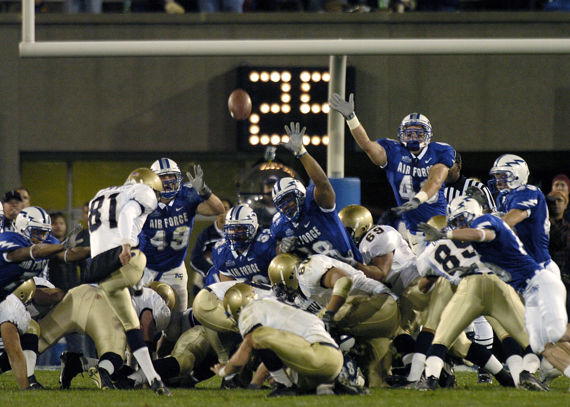 U.S. AIR FORCE ACADEMY, Colo. -- Navy kicker Geoff Blumenfeld gives Air Force the boot kicking a field goal with four seconds left in the game here Sept. 30.  The three-pointer gave the Midshipmen a 24-21 win over Air Force.  (U.S. Air Force photo by Charley Starr)