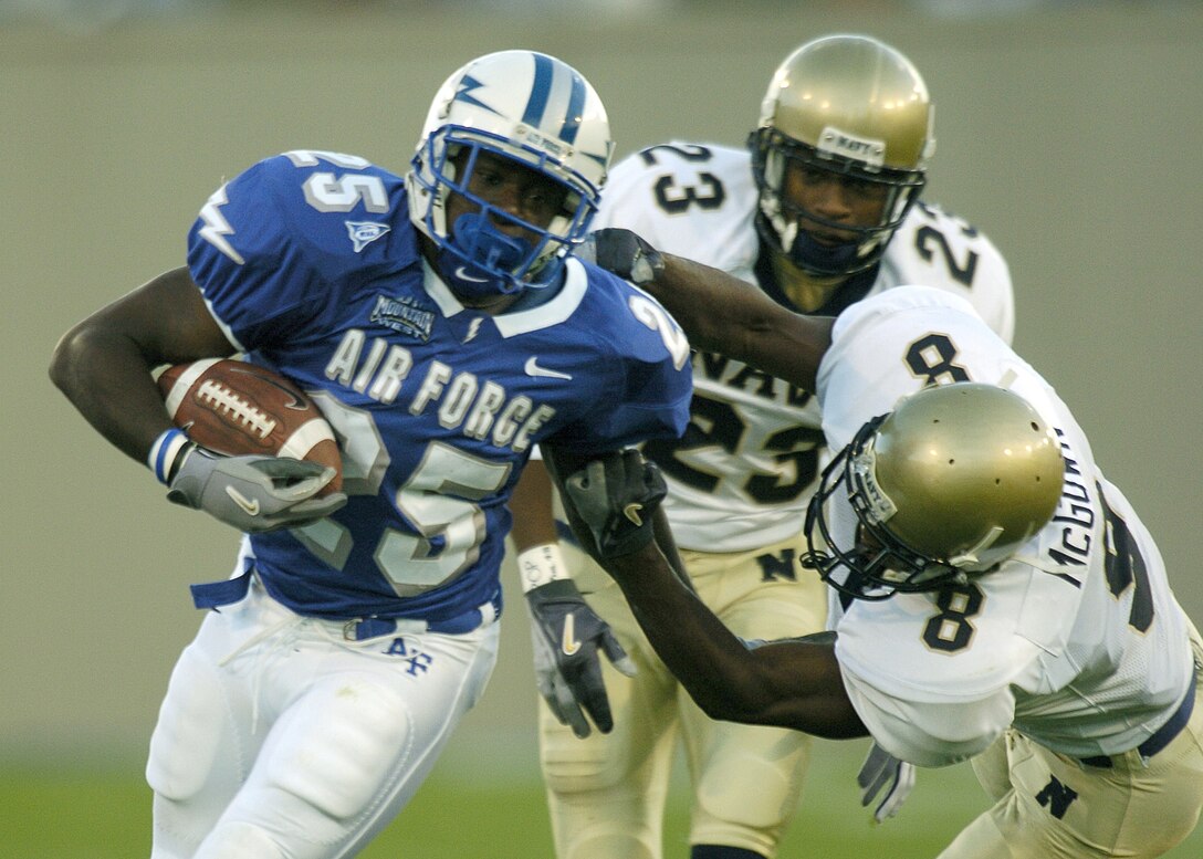 U.S. AIR FORCE ACADEMY, Colo. -- Falcon running back Anthony Butler eludes tacklers in the first quarter of Air Force's home game against service rival Navy on Sept. 30.  Navy won the game 24-21 eliminating Air Force from competition for this year's Commander-in-Chief Trophy.  (U.S. Air Force photo by Charley Starr)