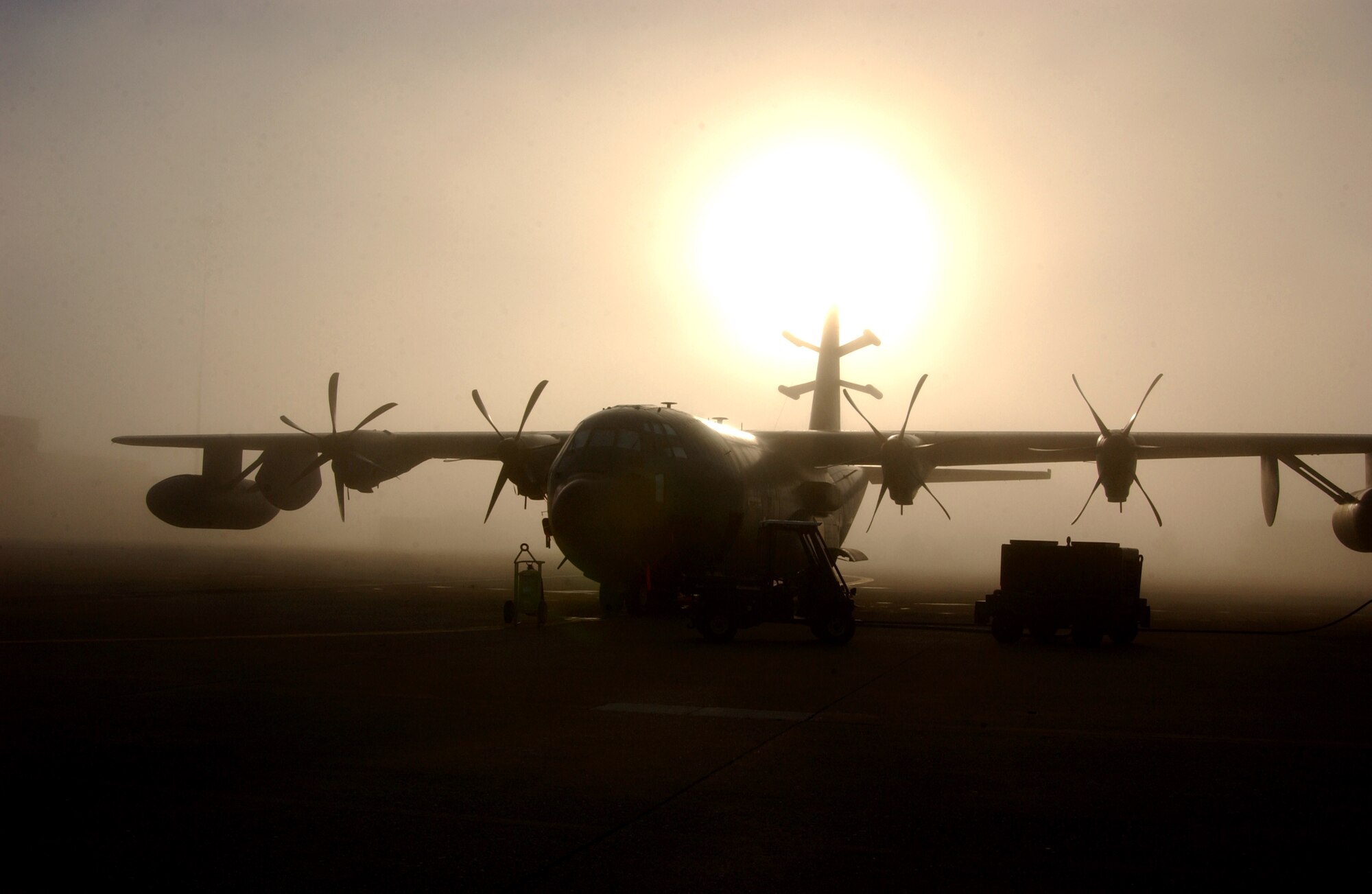 MIDDLETOWN, Pa. -- The sun rises behind a C-130J at the Pennsylvania Air National Guard's 193rd Special Operations Wing at Harrisburg International Airport here Oct. 1.  (U.S. Air Force photo by Senior Airman Matt Schwartz)