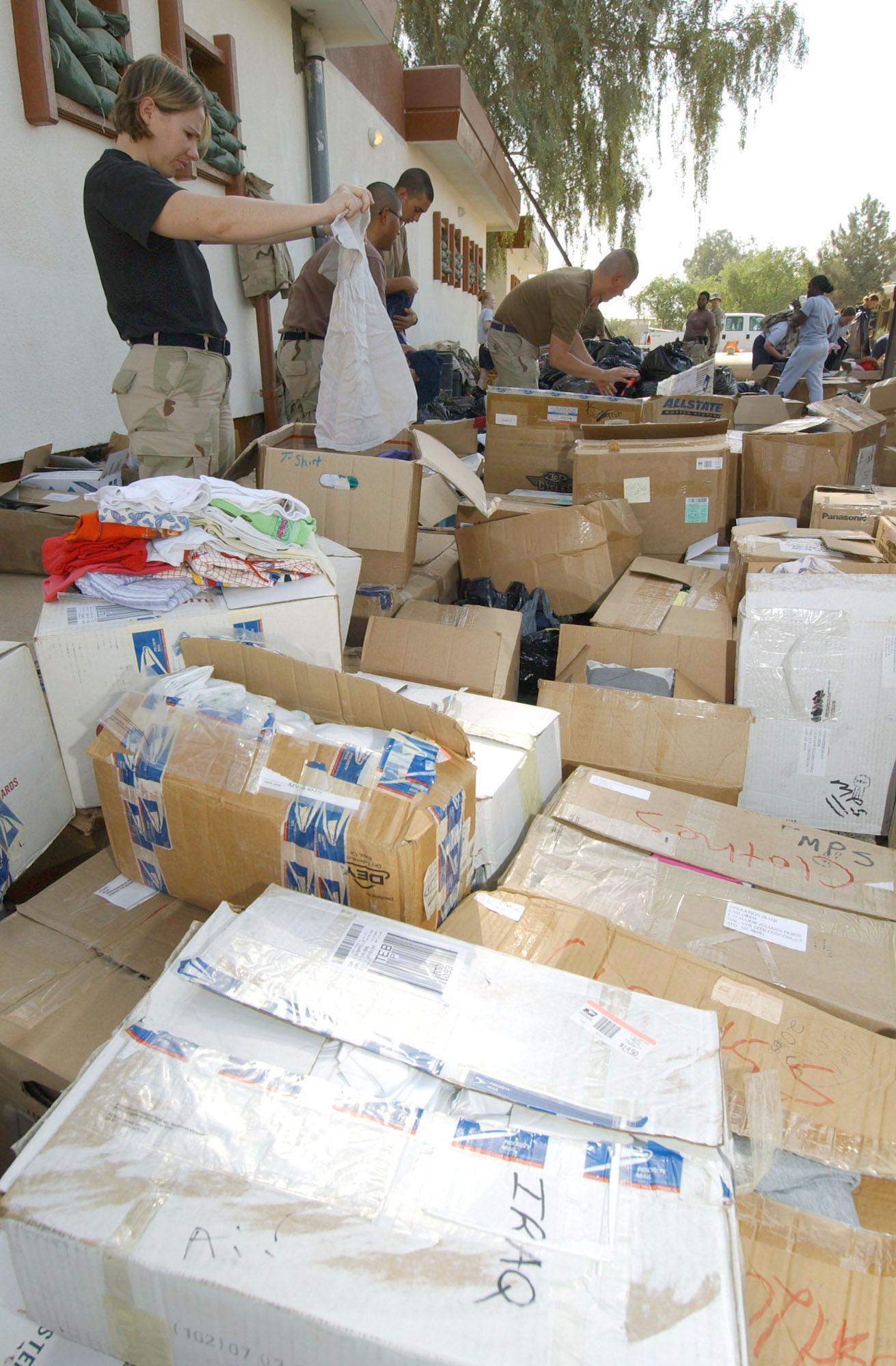 BALAD AIR BASE, Iraq -- Airmen from the 332nd Air Expeditionary Wing here organize school supplies and toys to be delivered to a local school.  (U.S. Air Force photo by Tech. Sgt. Robert Jensen)
              