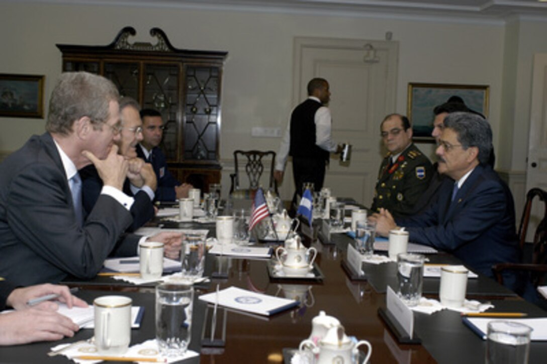 Honduran Minister of Defense Federico Breve (right) meets with Secretary of Defense Donald H. Rumsfeld (2nd from left) in the Pentagon on Oct. 6, 2004. Breve is meeting with Rumsfeld to discuss defense issues of mutual interest. From left to right is Assistant Secretary of Defense for International Security Affairs Peter Rodman, Rumsfeld, Commander, U.S. Military Group Col. Fernando Gonzalez, U.S. Air Force, International Chief of Staff Brig. Gen. Rodolfo Interiano Portillo, Honduran Ambassador to the U.S. Mario Miguel Canahuati (obscured), Breve. 